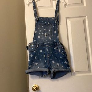 A cute. romper with stars and pockets